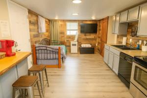 a small kitchen with a bed in a small room at Dillon Ave Homes in Cheyenne