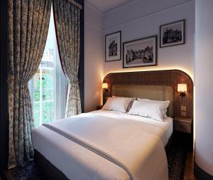 Ένα ή περισσότερα κρεβάτια σε δωμάτιο στο Bertrand's Townhouse