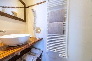 a bathroom with a white sink and a mirror at B&B La Halte Montaigne in Bordeaux +52 photos