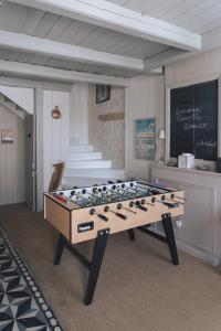 a large pool table in a room with a chalkboard at L'Olivier de Milou in Le Bois-Plage-en-Ré +54 photos