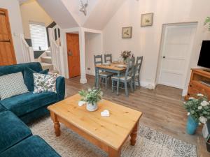 a living room with a couch and a table at 57 Cockpit Hill in Northallerton