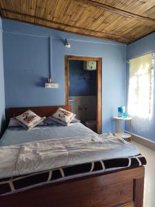 Postel nebo postele na pokoji v ubytování Sylvan homestay