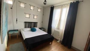 Postel nebo postele na pokoji v ubytování Mon p'tit nid