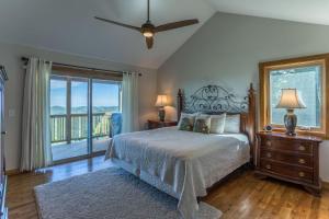 a bedroom with a bed and a balcony at 4330 Elevation in Boone