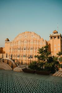a large building in front of a building at Jai Kutir Homestay - Hawa Mahal View in Jaipur