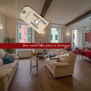 a large living room with a couch and a table at Tedea Apartment in Vernazza