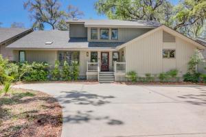 a house with a driveway at Fairway Oasis in Hilton Head Island