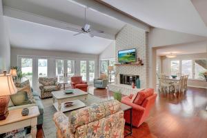a living room filled with furniture and a fireplace at Fairway Oasis in Hilton Head Island