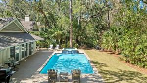 a swimming pool in the backyard of a house at Vicino al Mare in Hilton Head Island