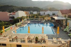 a view of a large swimming pool on a building at Hotel Athena in Kokkari