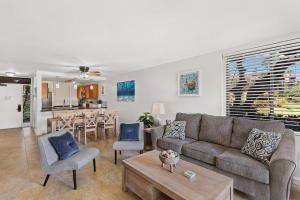 a living room with a couch and chairs and a table at Kamaole Sands 1101 · KAS 1101 Updated Beachy Chic 2BD Across Bea in Wailea