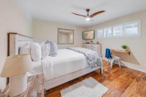 a bedroom with a white bed and a ceiling fan at Kaanapali Plantation 58 · KPL 58 Spacious 2BD Plantation Home Ne in Lahaina