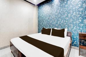 Ένα ή περισσότερα κρεβάτια σε δωμάτιο στο HOTEL O AKA HOTEL RESIDENCEs