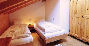 a room with two beds in a room at Gorgeous Home Saser in Santa Cristina in Val Gardena