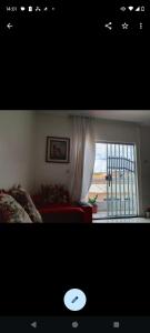 a bedroom with a bed and a window with a view at Casa Cop 30 Belém in Belém