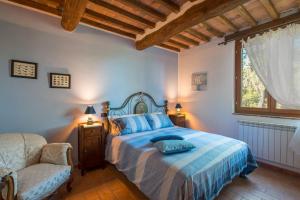 Ένα ή περισσότερα κρεβάτια σε δωμάτιο στο Podere La Tona