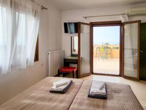 Ένα ή περισσότερα κρεβάτια σε δωμάτιο στο villa agnanti 'Marina' +30 φωτογραφίες