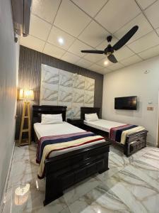 Ένα ή περισσότερα κρεβάτια σε δωμάτιο στο The Serene stays