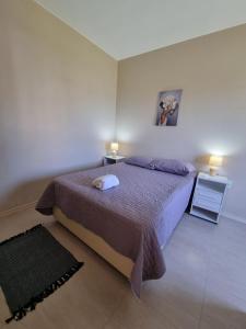 En eller flere senge i et værelse på Apartment 201 Farol de Santa Marta