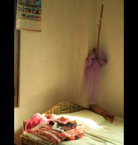 Postel nebo postele na pokoji v ubytování Murali Manohar homestay