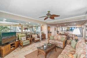 a living room filled with furniture and a flat screen tv at Kahana Village 31 · KHV 31 Spacious Direct Oceanfront 3BD Condo in Kahana