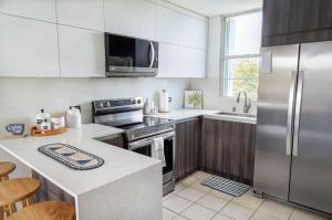 Kuchyň nebo kuchyňský kout v ubytování Marbella PH Apartment with Rooftop in Costa Brava Ceiba