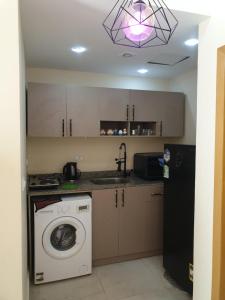 Kuchyň nebo kuchyňský kout v ubytování Lilyland Resort&water park