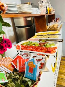 a counter with a bunch of food on it at Casona Ecoterra Hotel in Cusco