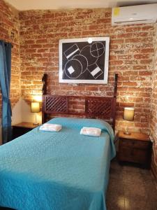 ラ・リベルタードにあるChilamar Surf Lodgeのベッドルーム1室(青いベッド1台付) +64枚の写真