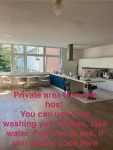 a room with a kitchen with a large kitchenasteryasteryasteryasteryasteryasteryastery at Private Room in Shared Apartment in Berlin