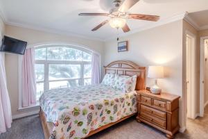 a bedroom with a bed and a window at 120 Beau Clair - Beachview Townhome with Balcony and Deck in Long Beach in Long Beach +21 photos