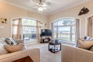 a living room with two couches and a flat screen tv at 120 Beau Clair - Beachview Townhome with Balcony and Deck in Long Beach in Long Beach