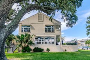 a house with a tree in front of it at 120 Beau Clair - Beachview Townhome with Balcony and Deck in Long Beach in Long Beach