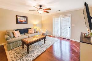 a living room with a couch and a table at Waterfront condo at Harbor Landing G02 - Relax in BEAUTIFUL Ocean Springs in Gulf Park Estates