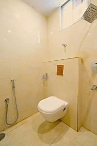 a bathroom with a toilet and a shower at Mio Boutique Hotel - Just Launched in Hyderabad +43 photos