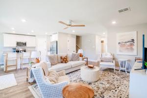 a living room with a couch and a table at BRAND NEW, fully furnished 3 bedroom, 3 bathroom home in Ocean Springs! in Gulf Hills