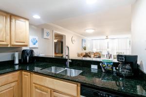 a kitchen with a sink and a counter top at Cozy 2 bed 2 bath condo at the beachside Ocean Club Villas in Beauvoir