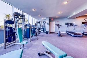 a gym with treadles and machines in a room at Beachview Condo at Beau View - 303 - fully furnished 3 bedroom 3 bathroom in De Buys