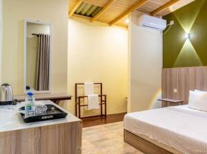 Postel nebo postele na pokoji v ubytování Airport Lounge by Sandamalee + 18 fotografií