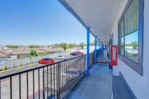 an empty building with cars parked in a parking lot at Super 7 Inn By OYO San Antonio NW Medical Center in San Antonio +35 photos