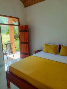 Ένα ή περισσότερα κρεβάτια σε δωμάτιο στο Forest & Fields Sinharaja - Where Nature Circles You