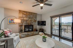 a living room with a couch and a fireplace at Chetola: Robin 1 in Blowing Rock