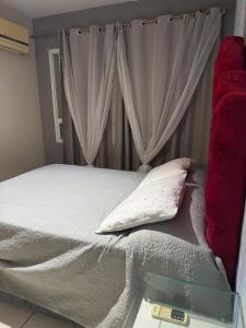 Ένα ή περισσότερα κρεβάτια σε δωμάτιο στο Yatch village ap completo vista mar