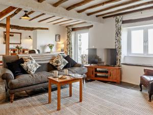 a living room with a couch and a table at 6 Bed in Harlech 91546 in Harlech