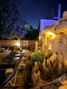 a resort with a cactus garden at night at Al Baeirat Hotel in Luxor