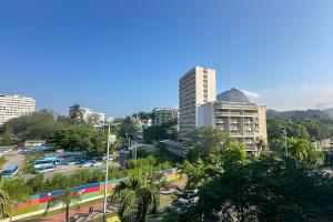 a view of a city with buildings and a street at Mario401| Loft in Leblon next do Lagoa in Rio de Janeiro