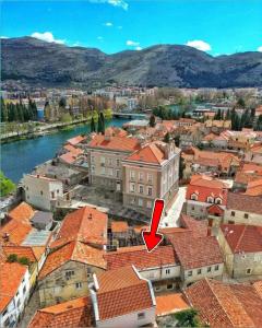 a view of a city with a red roof at Apartman Magic moments Stari Grad in Trebinje