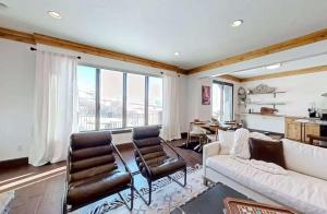 a living room with a white couch and chairs at Wild Horse Meadows Eden Powder Mtn in Wolf Star