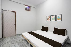 Ένα ή περισσότερα κρεβάτια σε δωμάτιο στο Hotel O Sangam Gardan