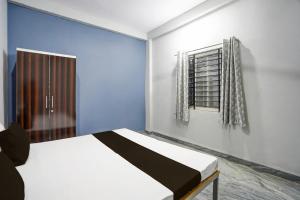 Ένα ή περισσότερα κρεβάτια σε δωμάτιο στο Hotel O Sangam Gardan